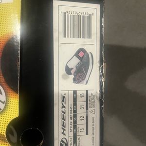 Size 13 kids grey and pink Heelys never worn